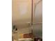 This bathroom showcases a tiled shower with glass door, blending classic style with privacy and functionality at 1685 Dogwood Trl, Douglasville, GA 30134