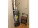 This space showcases a water heater, accompanied by a handy step stool, blending utility with everyday convenience at 1685 Dogwood Trl, Douglasville, GA 30134