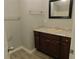 Stylish bathroom with granite vanity, wood cabinets, and updated fixtures at 99 Libby Ln, Jonesboro, GA 30238
