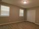 This bedroom is equipped with two windows and a closet at 99 Libby Ln, Jonesboro, GA 30238