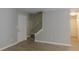Inviting entryway with wood-look flooring, white door, and staircase leading to the upper level at 99 Libby Ln, Jonesboro, GA 30238