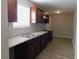 Eat-in kitchen featuring grey countertop and stainless steel sink at 99 Libby Ln, Jonesboro, GA 30238