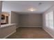 Spacious living room featuring wood-look floors and views of the kitchen area with a breakfast bar at 99 Libby Ln, Jonesboro, GA 30238