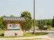 Welcoming entrance to Joint Venture Park with well-maintained landscaping at 542 Healy Dr # 52, Cumming, GA 30040