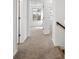 Spacious hallway with carpeted flooring and access to bedrooms at 3813 Thatcher Sw Dr, Marietta, GA 30008