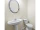 Clean powder room with a pedestal sink and a silver-framed mirror at 3298 Sheffield Cir, Decatur, GA 30032