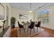 Inviting dining room featuring a modern table set, a bright window, and hardwood floors at 3298 Sheffield Cir, Decatur, GA 30032