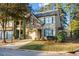 Charming two-story home with stone accents, attached garage, and manicured front lawn at 3298 Sheffield Cir, Decatur, GA 30032