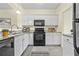 Well-maintained kitchen with white cabinets, granite countertops, and stainless steel appliances at 3298 Sheffield Cir, Decatur, GA 30032