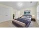 Calm main bedroom featuring a neutral color scheme, ample closet space and large window at 3298 Sheffield Cir, Decatur, GA 30032