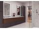 Elegant bathroom with double vanity, marble countertops, and a glass-enclosed shower and walk in closet at 318 Sandy Springs Cir # 310, Sandy Springs, GA 30328