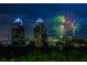 Night view of city skyline with fireworks display at 318 Sandy Springs Cir # 310, Sandy Springs, GA 30328