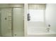 Bright bathroom with walk-in shower and soaking tub at 5418 Flat Rock Pt, Stonecrest, GA 30038