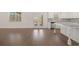 Open concept kitchen and Gathering room with hardwood floors, island, and stainless steel appliances at 5418 Flat Rock Pt, Stonecrest, GA 30038