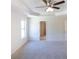 Spacious main bedroom with carpet and ceiling fan at 5418 Flat Rock Pt, Stonecrest, GA 30038
