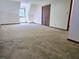 Large bedroom with neutral carpet, window and closet at 25 Ridgeview Dr, Jonesboro, GA 30236