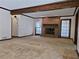 Cozy living room featuring a brick fireplace, neutral carpet, and large windows at 25 Ridgeview Dr, Jonesboro, GA 30236