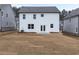 Backyard view of new construction home with a patio, and freshly seeded lawn in a suburban neighborhood at 79 Hampton Ter, Dallas, GA 30157