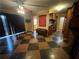 Open dining area with wood flooring and access to kitchen at 1868 Fort Valley Sw Dr, Atlanta, GA 30311