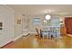 Dining area with hardwood floors, a rustic table, and a view of the front entrance at 1453 Midview Dr, Decatur, GA 30032