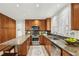 Modern kitchen with granite countertops and stainless steel appliances at 655 Amberidge Trl, Atlanta, GA 30328