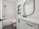 Modern bathroom with white cabinets and marble tile at 3225 Greenfield Dr, Marietta, GA 30068