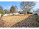 Spacious backyard with a large grassy area and a white privacy fence at 259 Diamond Valley Pass, Canton, GA 30114