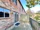 Back porch with railing and red brick exterior at 3125 Colonial Way # M, Atlanta, GA 30341