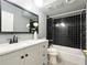 Bathroom featuring a modern vanity, black tile, and a shower-tub combo at 3125 Colonial Way # M, Atlanta, GA 30341