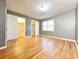 Bedroom with hardwood floors, light, neutral walls, and closets at 3125 Colonial Way # M, Atlanta, GA 30341