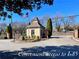 Entrance to community featuring a gate house and manicured landscaping. Convenient access to I-85 at 3125 Colonial Way # M, Atlanta, GA 30341