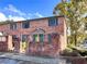 Charming brick building with green shutters and a well-maintained garden, showcasing curb appeal at 3125 Colonial Way # M, Atlanta, GA 30341