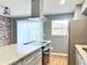 Modern kitchen features gray cabinets, stainless steel appliances, granite countertops, and an electric stovetop at 3125 Colonial Way # M, Atlanta, GA 30341