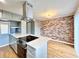 Kitchen island featuring an electric cooktop and an oven in modern renovated home at 3125 Colonial Way # M, Atlanta, GA 30341