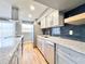 Modern kitchen features gray cabinets, stainless steel appliances, dark backsplash, and granite countertops at 3125 Colonial Way # M, Atlanta, GA 30341