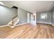 Open concept living room with hardwood floors and staircase at 3125 Colonial Way # M, Atlanta, GA 30341