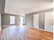 Bright living room featuring hardwood floors, a window, and a staircase at 3125 Colonial Way # M, Atlanta, GA 30341