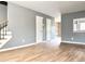 Open living room showcasing hardwood floors and neutral gray wall paint at 3125 Colonial Way # M, Atlanta, GA 30341