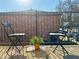 Outdoor patio featuring two chairs and a table on a sunny day, perfect for relaxing and enjoying the fresh air at 3125 Colonial Way # M, Atlanta, GA 30341