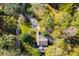 An aerial view of a home surrounded by lush greenery, offering privacy and a sense of seclusion at 250 Big Oak Rd, Whitesburg, GA 30185