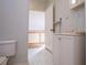 Cozy bathroom with white tiled floors and a vanity with white cabinets at 250 Big Oak Rd, Whitesburg, GA 30185