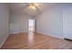Bright bedroom featuring hardwood floors, neutral walls, and a ceiling fan at 250 Big Oak Rd, Whitesburg, GA 30185