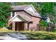 A two-story brick home sits on a well-wooded lot at 250 Big Oak Rd, Whitesburg, GA 30185