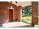 A brick porch provides a charming entrance at 250 Big Oak Rd, Whitesburg, GA 30185