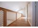 Hallway featuring wood floors and a white lattice railing and trim at 250 Big Oak Rd, Whitesburg, GA 30185