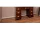 A traditional dark wood office desk featuring multiple drawers and gold hardware at 250 Big Oak Rd, Whitesburg, GA 30185