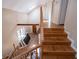 A multilevel home entryway and staircase featuring hardwood and natural lighting at 250 Big Oak Rd, Whitesburg, GA 30185