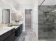 Modern bathroom featuring a gray tile shower, double vanity, and neutral decor at 308 Thistle Ct, Woodstock, GA 30189