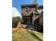 Small backyard with patio and exterior access at 6745 Trafalger Sq, Norcross, GA 30093