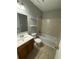 Clean bathroom with tub, toilet and vanity at 6745 Trafalger Sq, Norcross, GA 30093